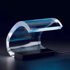 Oluce Acrilica 281/LBT table lamp glowing in dark setting by LoríaDesign