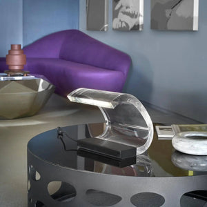 Oluce Acrilica 281/LBT table lamp in room with purple sofa by LoríaDesign