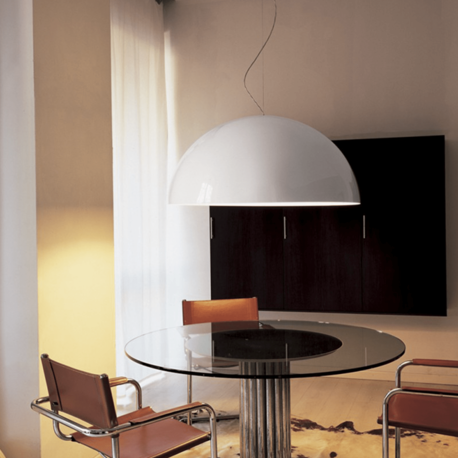 Pair of Oluce Sonora Pendant Lamps in a modern lounge – Italian luxury lighting.